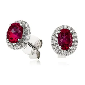 18ct White Gold 0.75ct Oval Ruby and 0.15ct Diamond Halo Stud Earrings