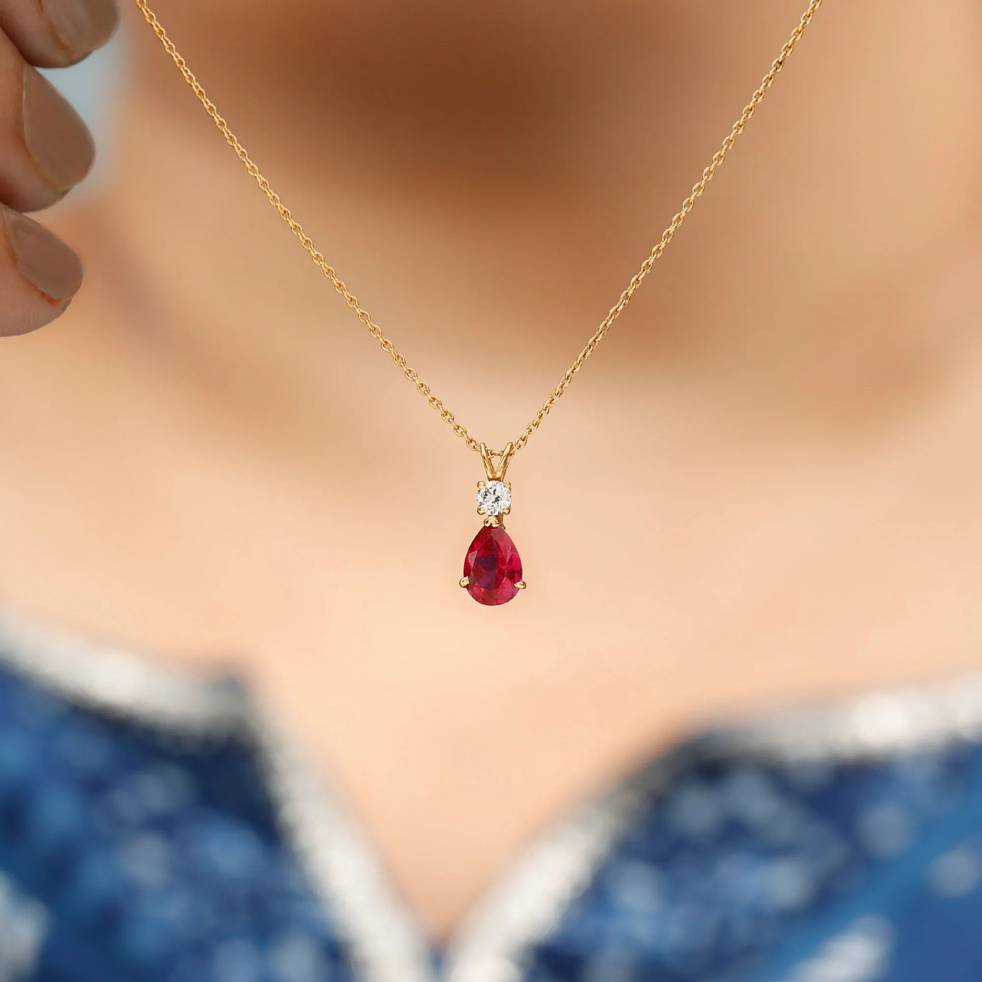 Pear Shape Lab Grown Ruby Solitaire Pendant with Moissanite