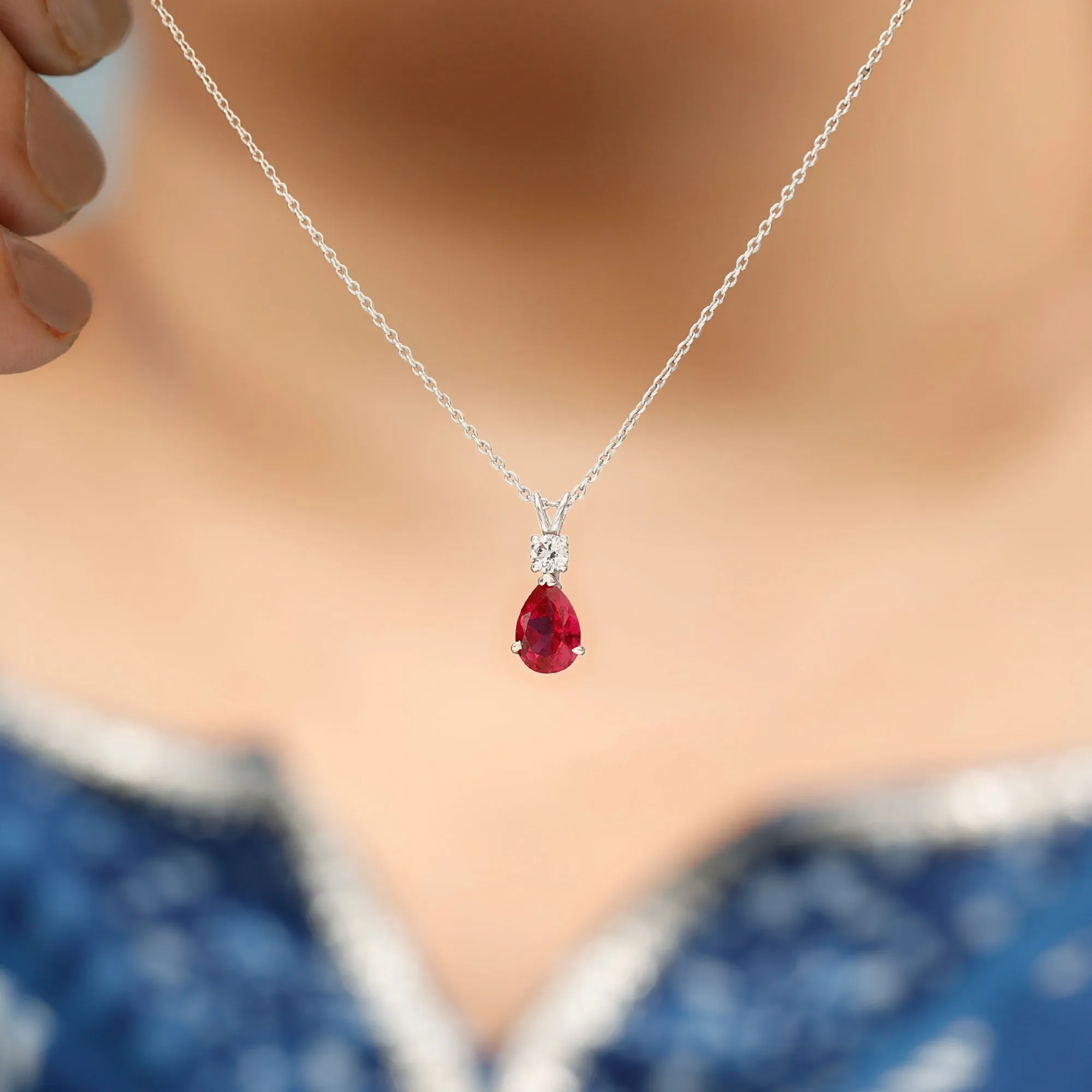 Pear Shape Lab Grown Ruby Solitaire Pendant with Moissanite