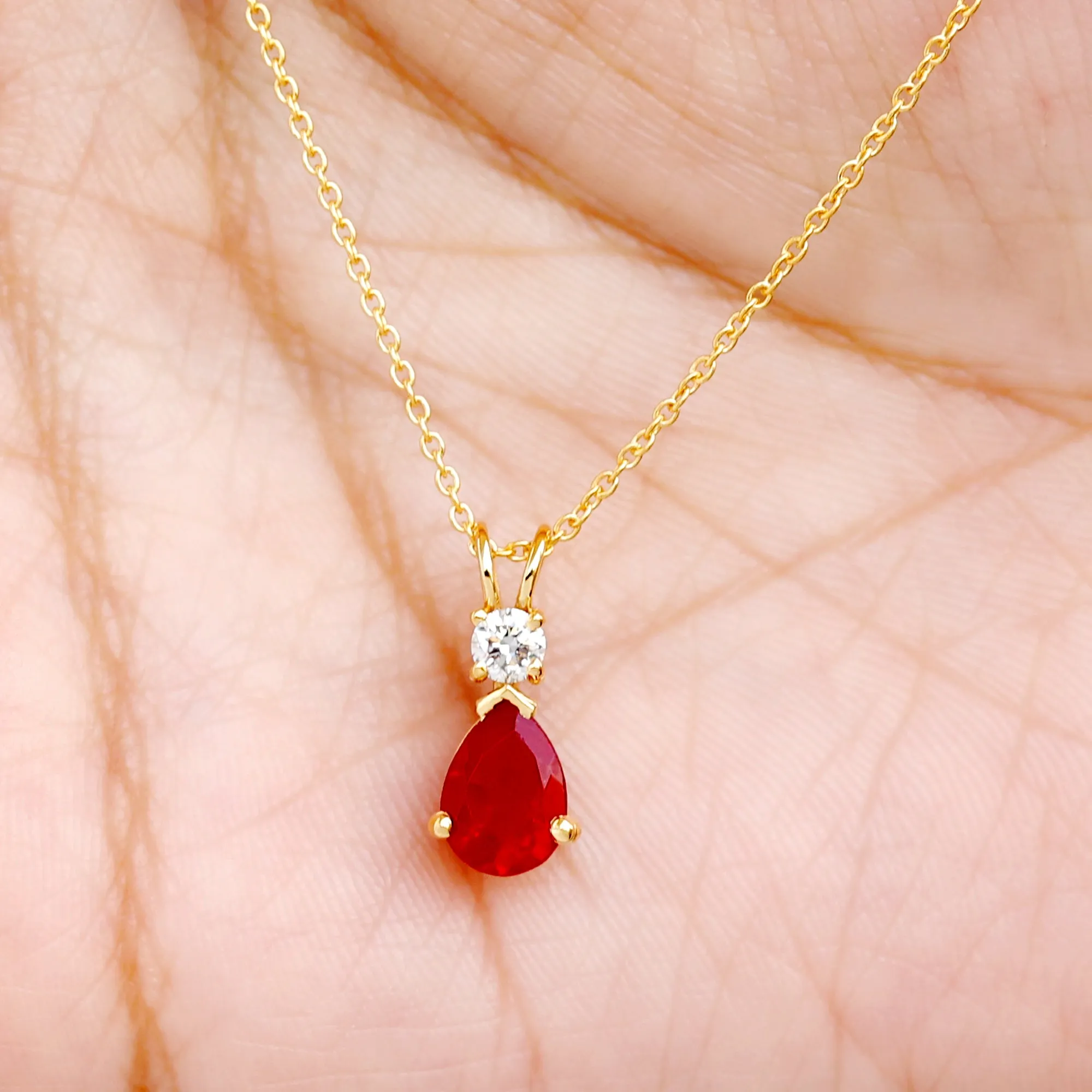 Pear Shape Lab Grown Ruby Solitaire Pendant with Moissanite