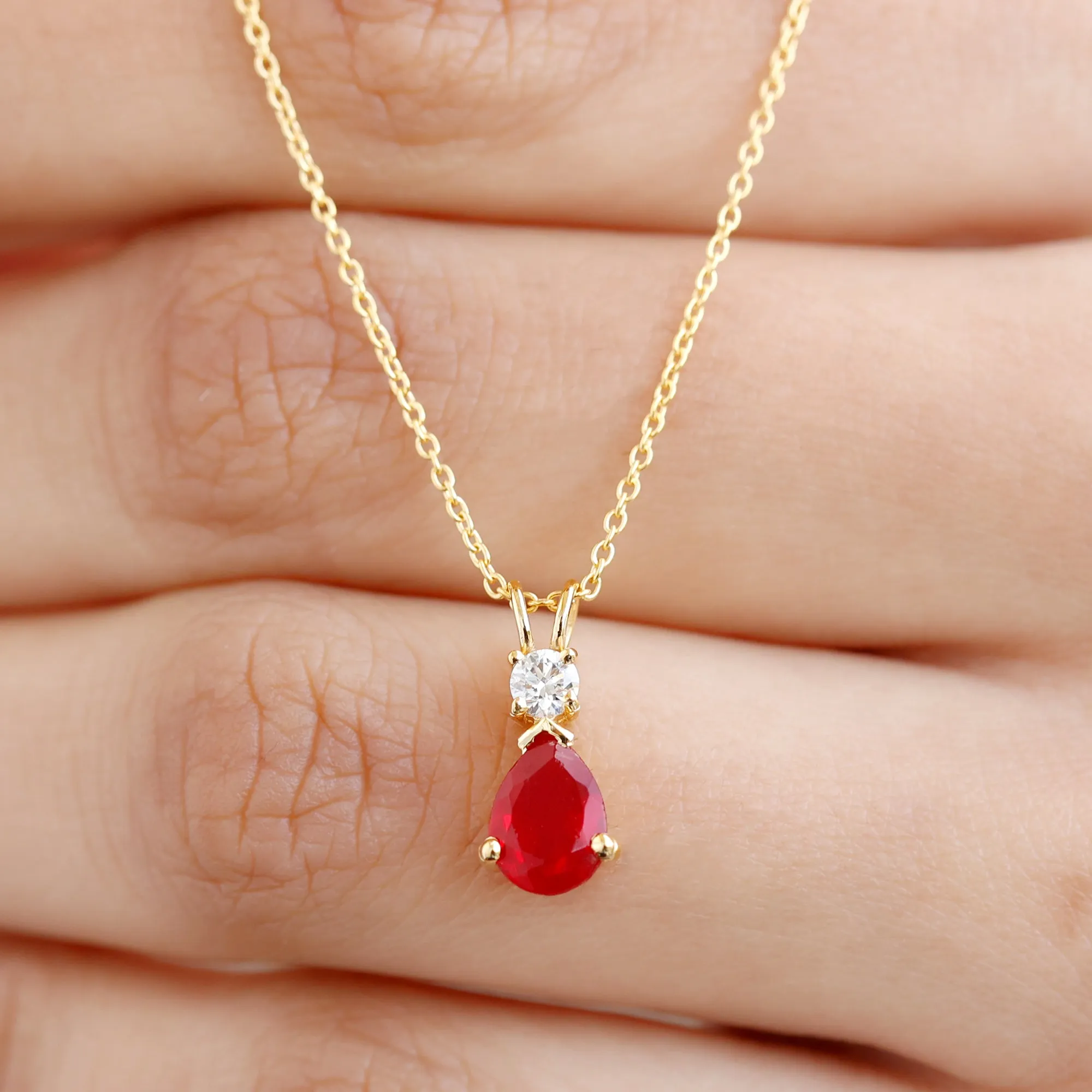 Pear Shape Lab Grown Ruby Solitaire Pendant with Moissanite