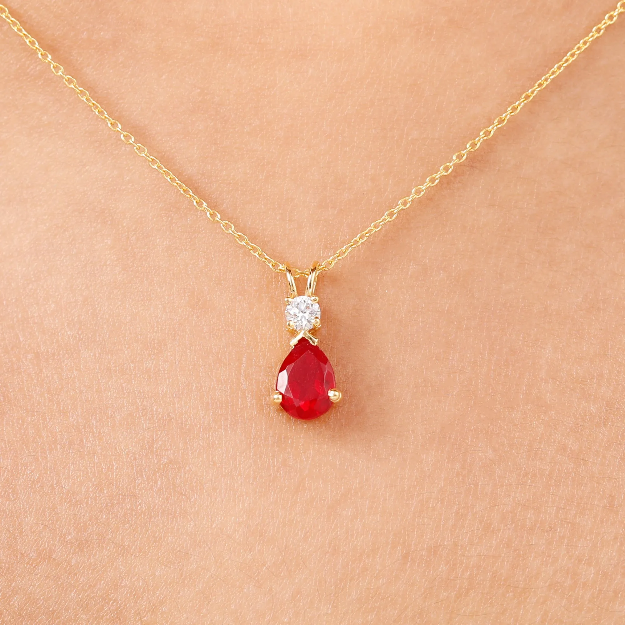 Pear Shape Lab Grown Ruby Solitaire Pendant with Moissanite