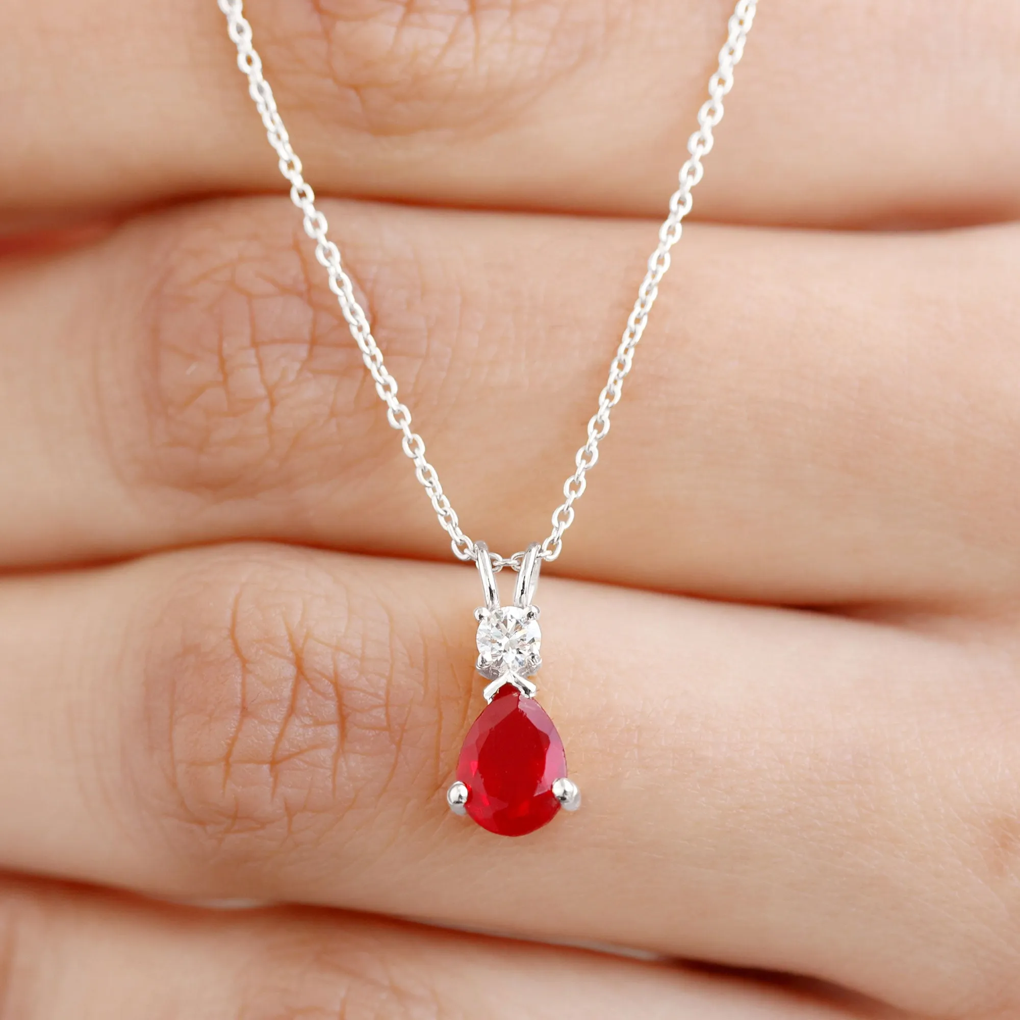Pear Shape Lab Grown Ruby Solitaire Pendant with Moissanite